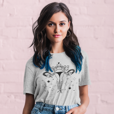 woman wearing a floral uterus t-shirt
