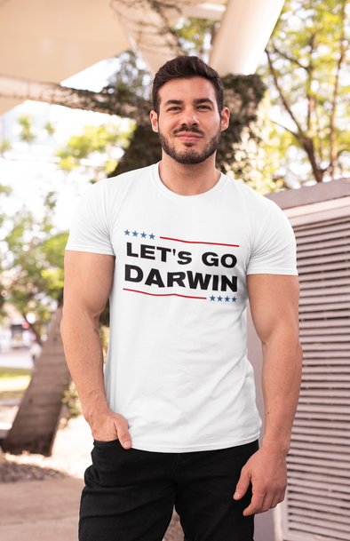 man wearing a lets go darwin t-shirt
