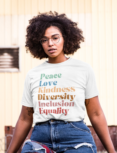 woman wearing a shirt that says peace love kindness diversity inclusion equality shirt