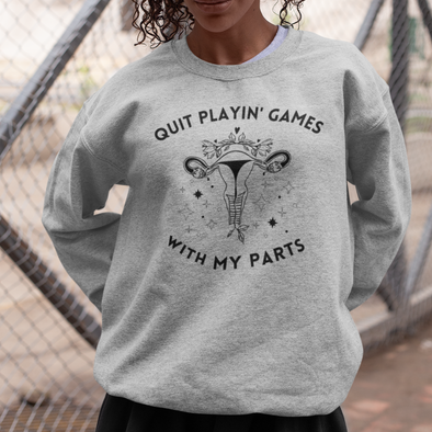 sweatshirt with a floral uterus that says quit playin games with my parts
