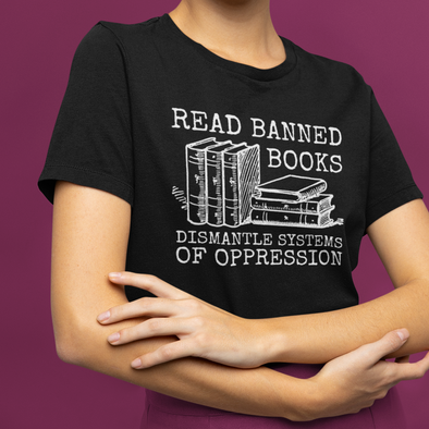 black shirt with books that says read banned books dismantle systems of oppression