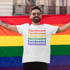 Man wearing a rainbow vaccinated shirt and holding a gay pride flag